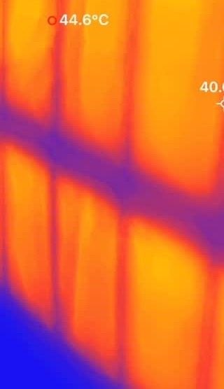 Thermal camera image showing warmth spread across a heated wall